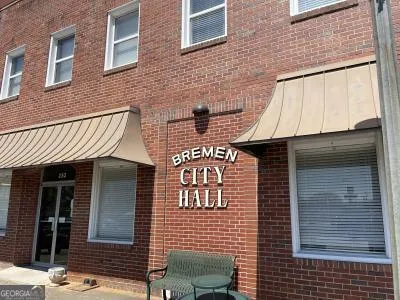 a view of a porch with a table and chairs