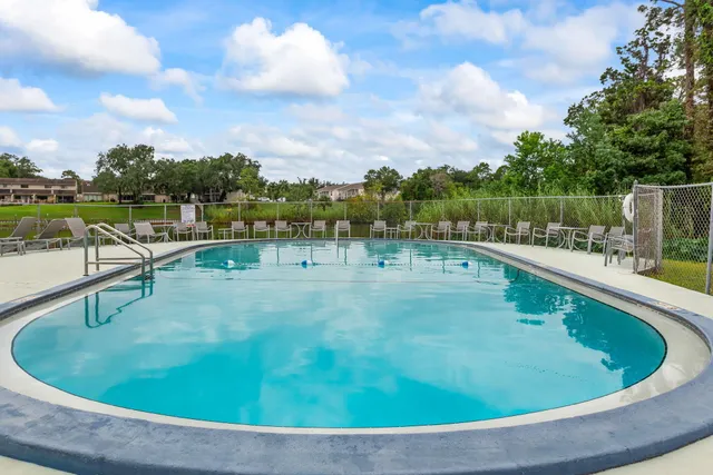 a view of a swimming pool with a patio