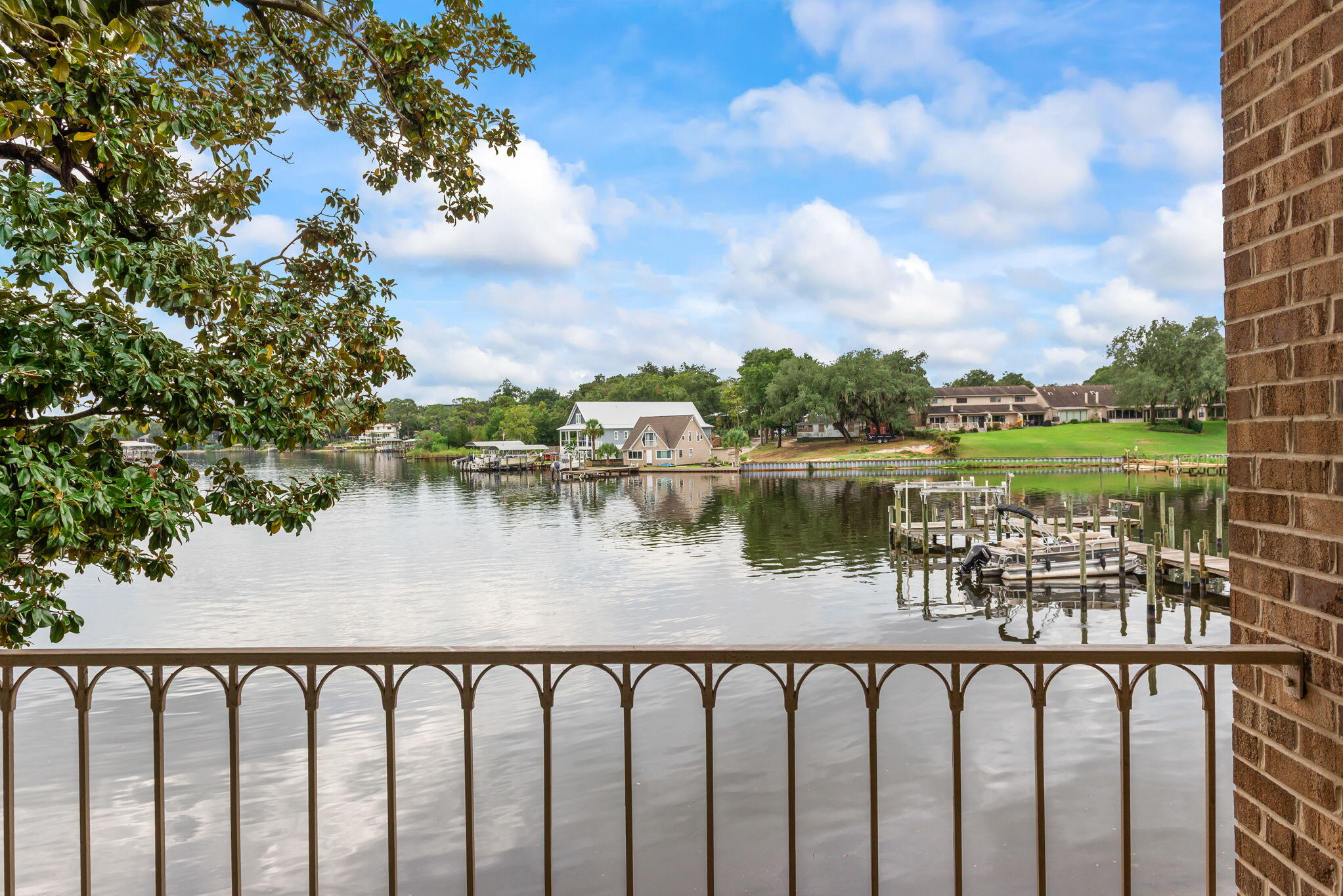 210 Pelham Road, Unit B107 Fort Walton Beach, FL 32547 - Photo 2 of 14 a view of a lake from a roof deck