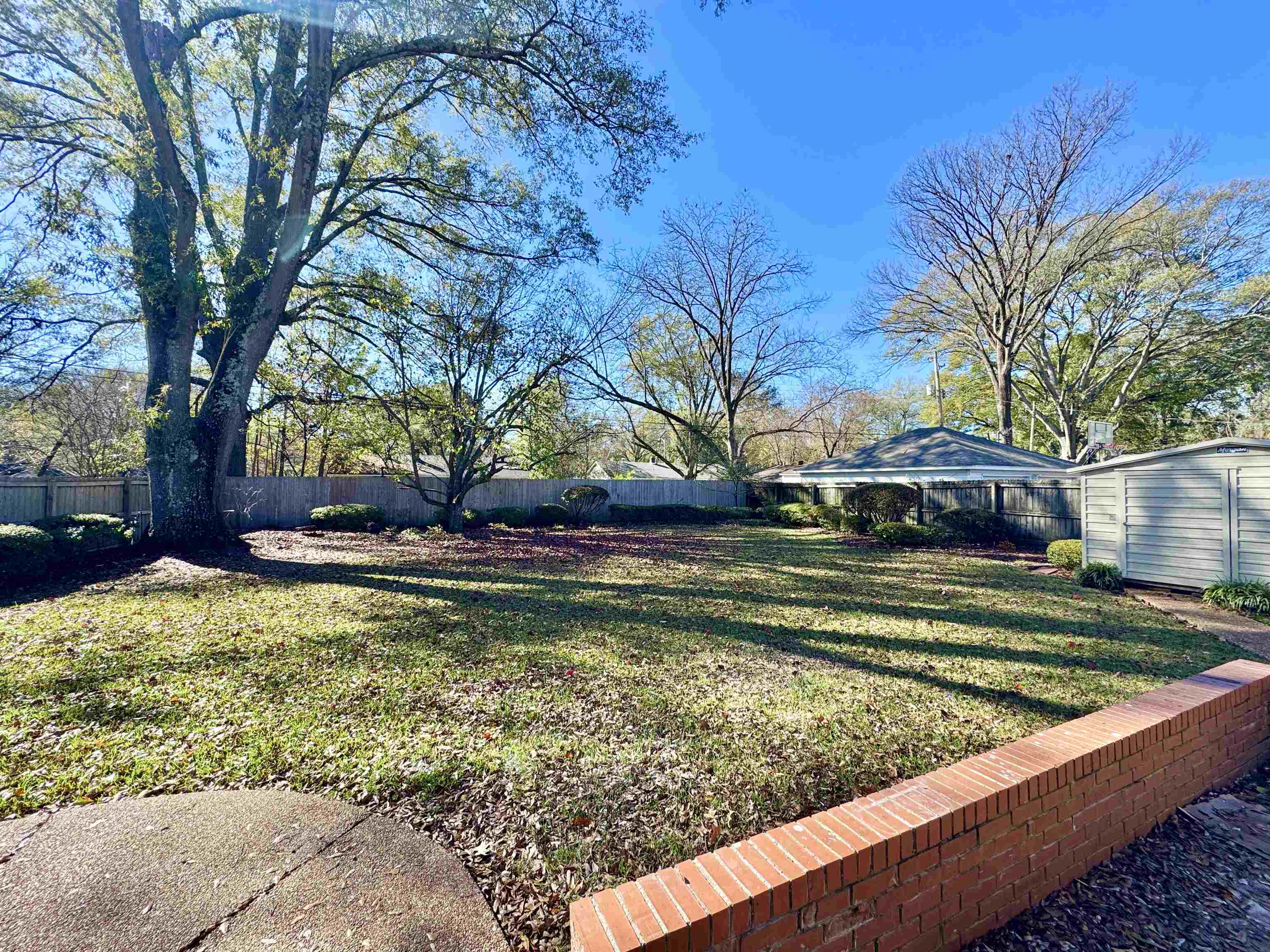 4417 Fair Meadow Road Memphis, TN 38117 - Photo 31 of 38 Fenced backyard with an outdoor structure
