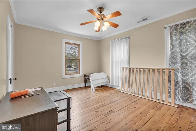 a workspace with furniture and window