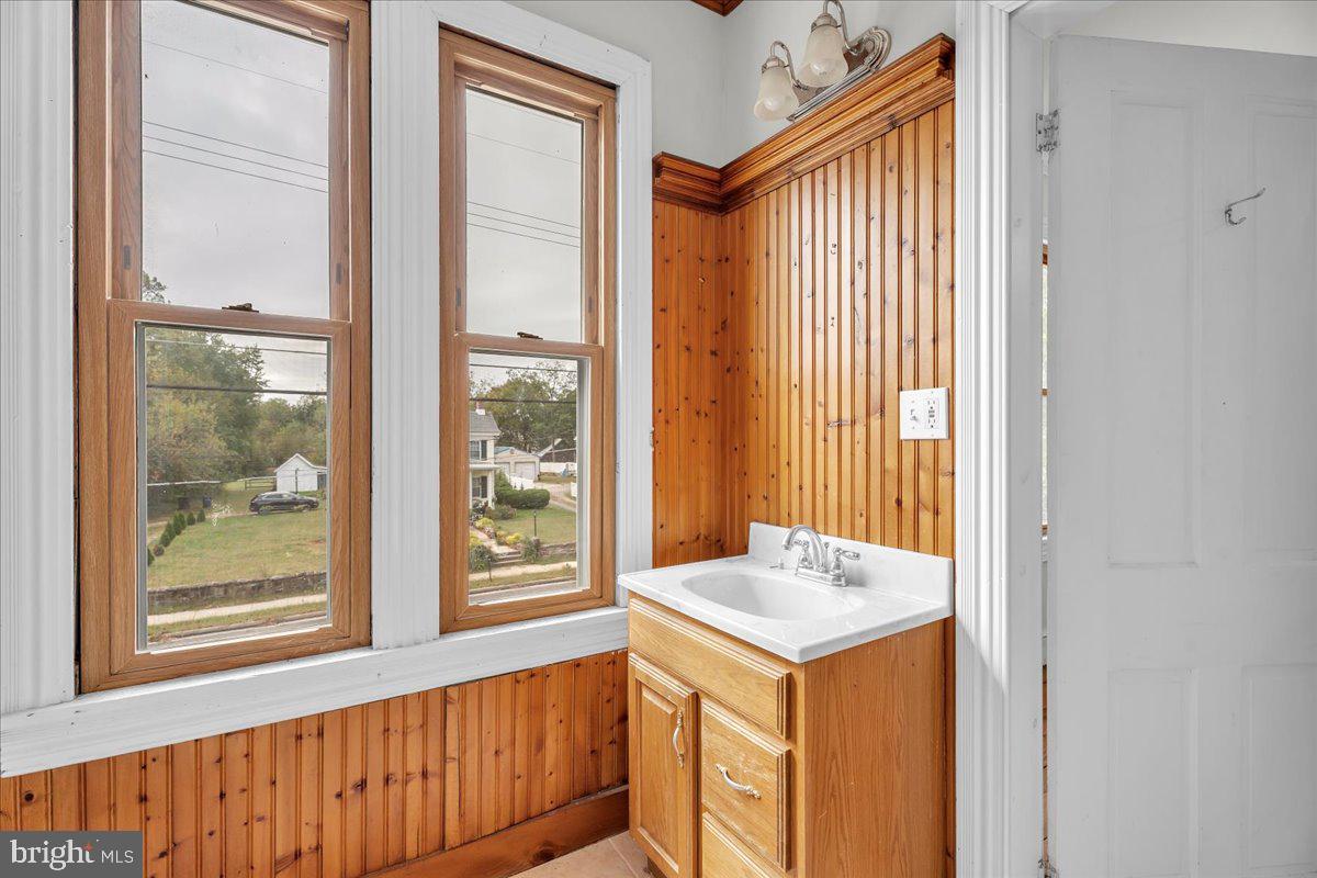211 South Main Street Elmer, NJ 08318 - Photo 19 of 24 a view of bathroom with a sink and a window