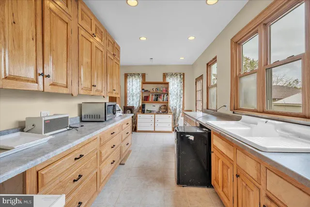 a kitchen with stainless steel appliances granite countertop a sink and a stove