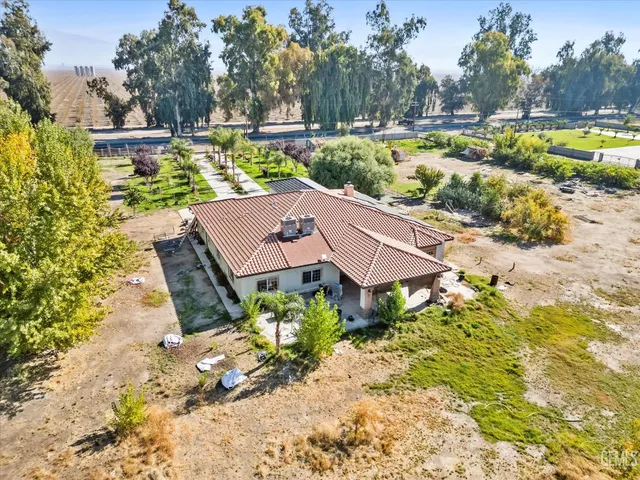 a table and chairs in a garden