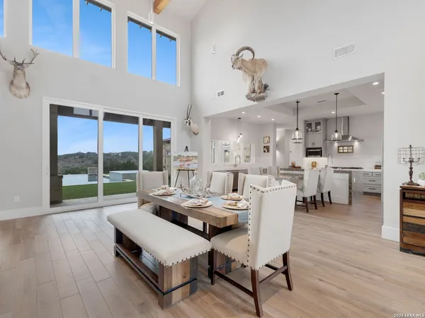 a kitchen with kitchen island a counter top space a sink appliances and cabinets