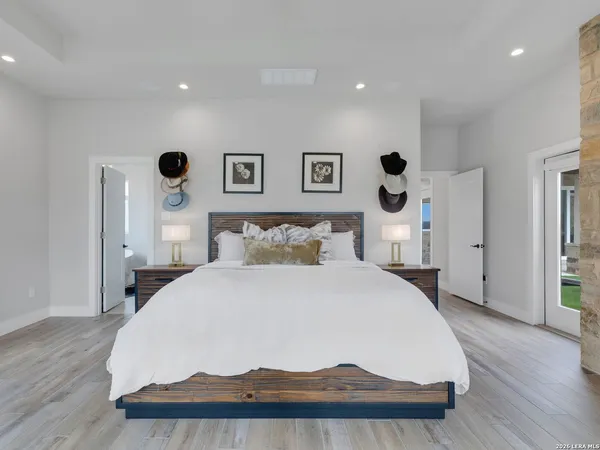 a spacious bedroom with a bed and a fireplace