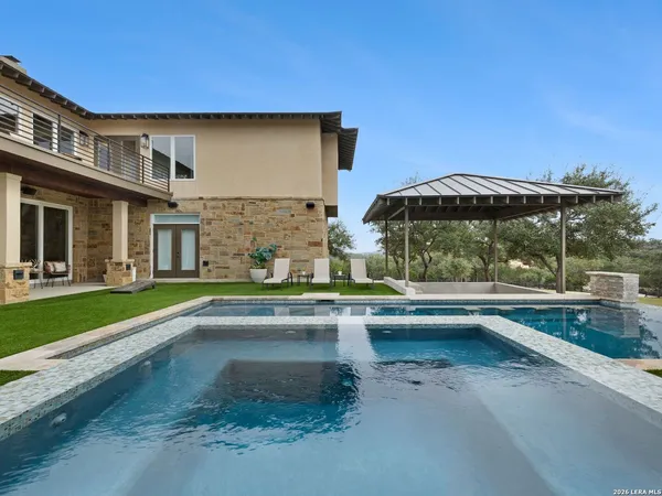 a aerial view of a house with pool and deck