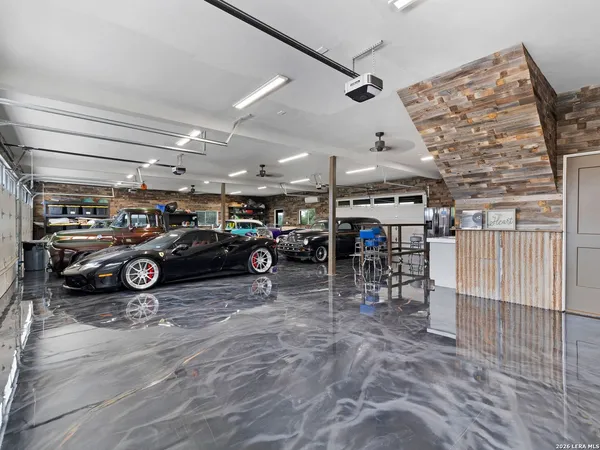 an aerial view of multiple houses with a yard