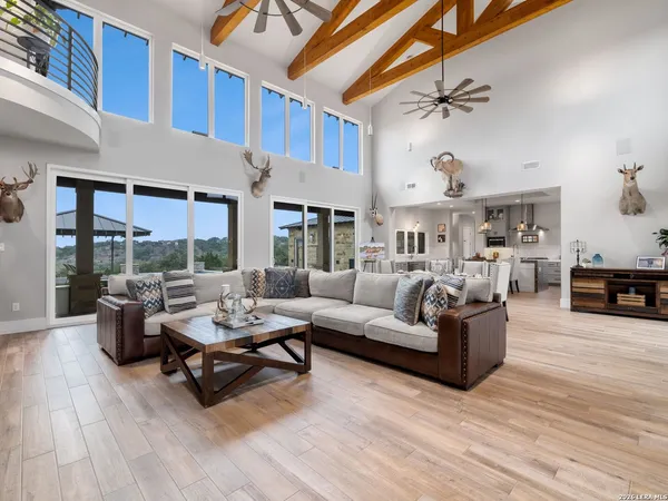 a dining room with furniture a fireplace and wooden floor