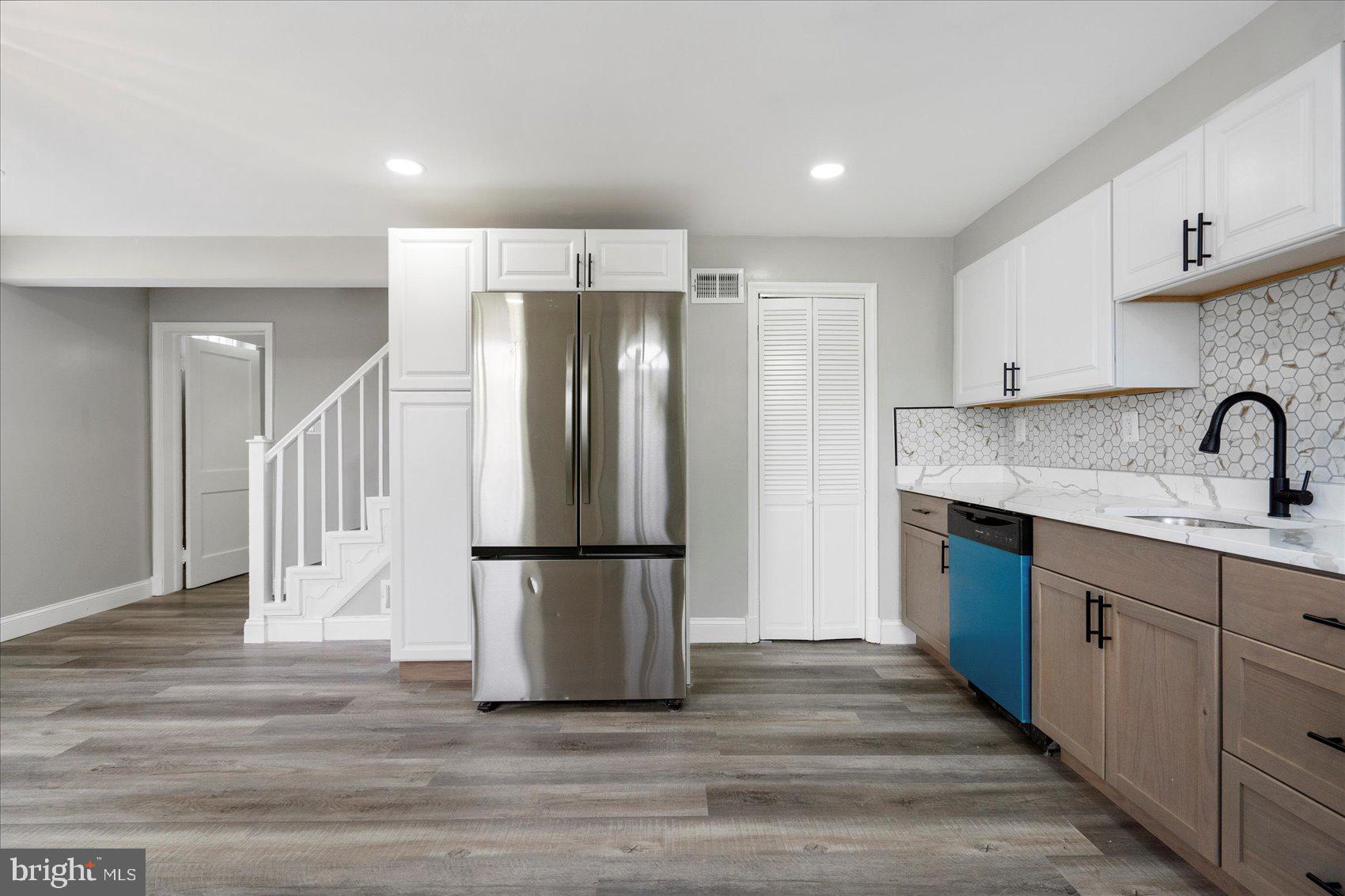1601 Burnwood Road Baltimore, MD 21239 - Photo 18 of 46 a kitchen with stainless steel appliances a refrigerator and a cabinets