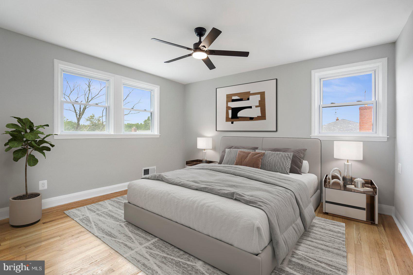 1601 Burnwood Road Baltimore, MD 21239 - Photo 4 of 46 a bedroom with a bed and wooden floor