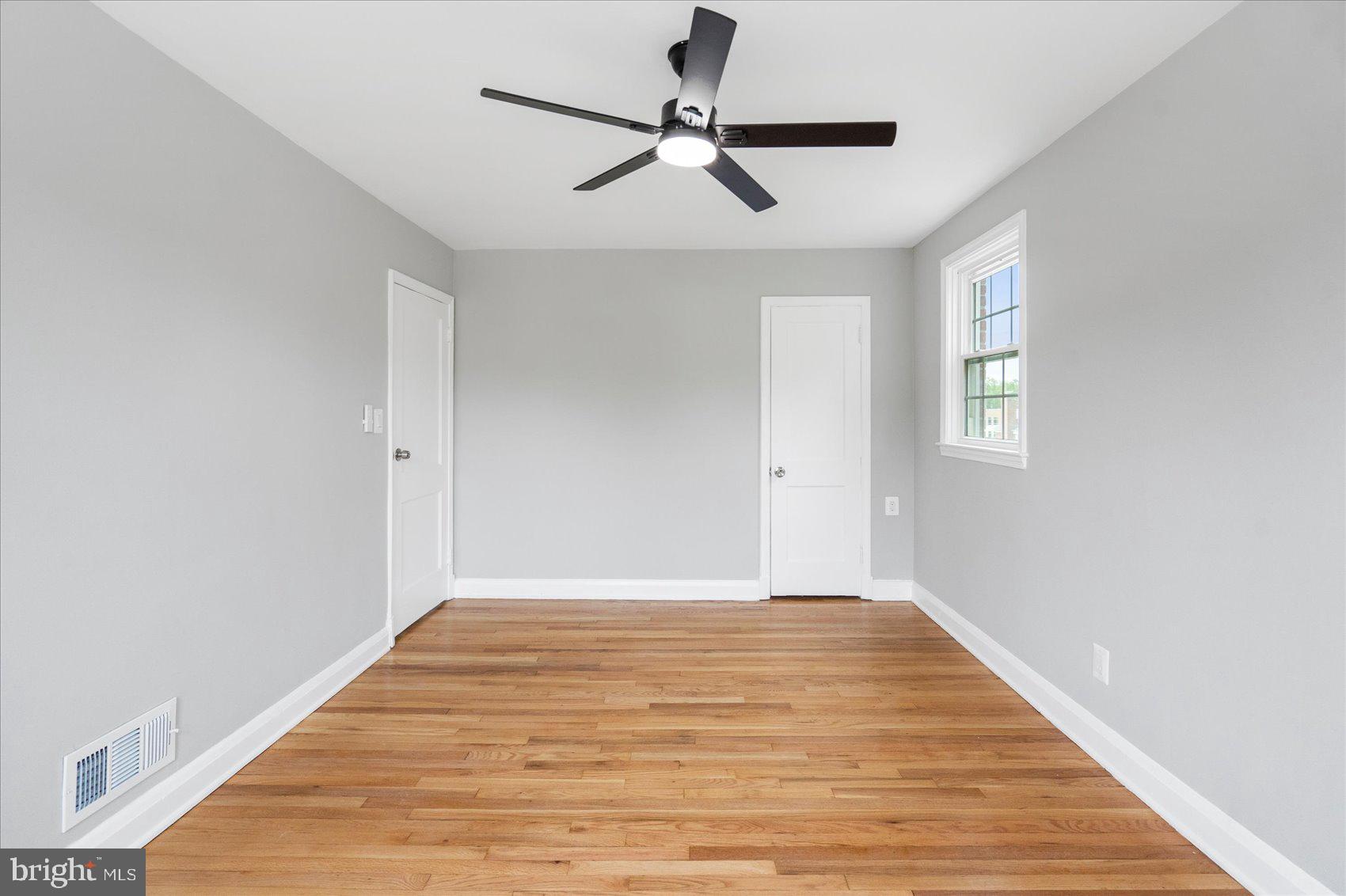 1601 Burnwood Road Baltimore, MD 21239 - Photo 41 of 46 a view of empty room with wooden floor