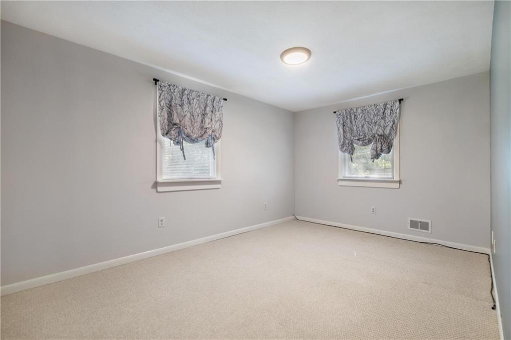 522 Upper Road Pittsburgh, PA 15228 - Photo 21 of 45 an empty room with windows and closet