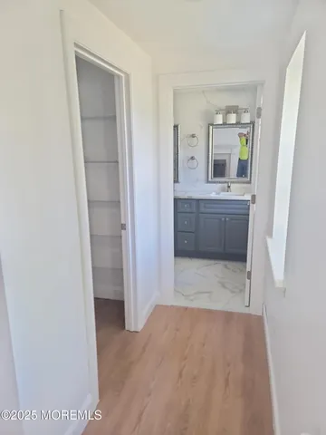 a bathroom with a tub shower and sink