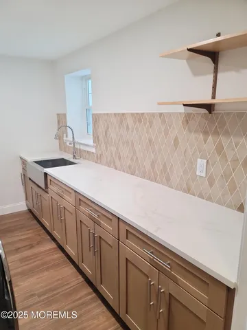 a view of a hallway with washer and dryer