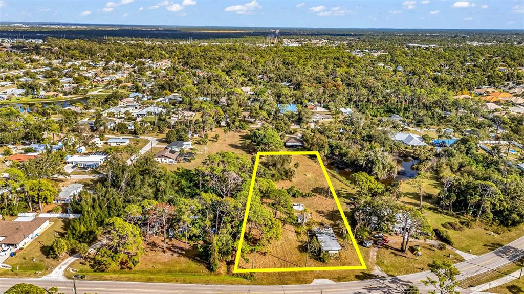 787 Old Englewood Road Englewood, FL 34223 - Photo 1 of 6 view of a large yard