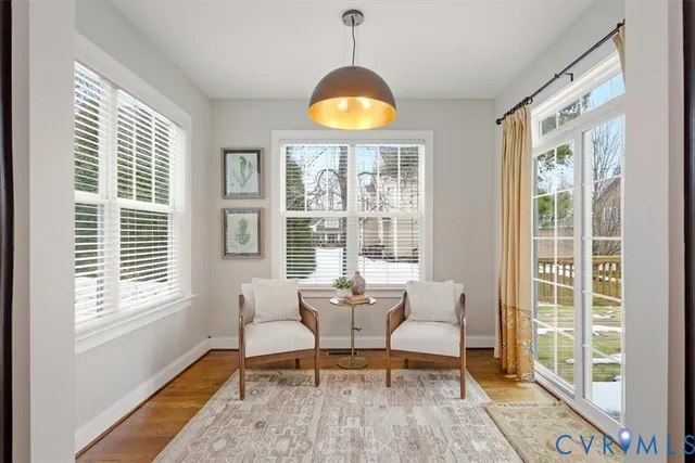 a white bath tub sitting next to a shower