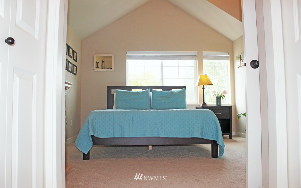 5020 Delridge Way Southwest, Unit A Seattle, WA 98106 - Photo 12 of 22 a bedroom with a bed and window
