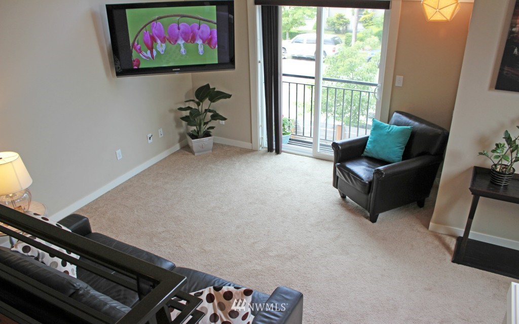 5020 Delridge Way Southwest, Unit A Seattle, WA 98106 - Photo 3 of 22 a living room with furniture and a flat screen tv
