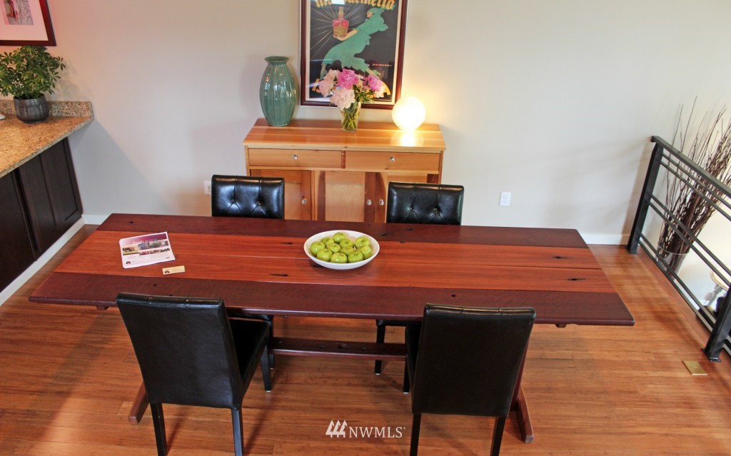5020 Delridge Way Southwest, Unit A Seattle, WA 98106 - Photo 5 of 22 a view of a dining room with furniture and wooden floor