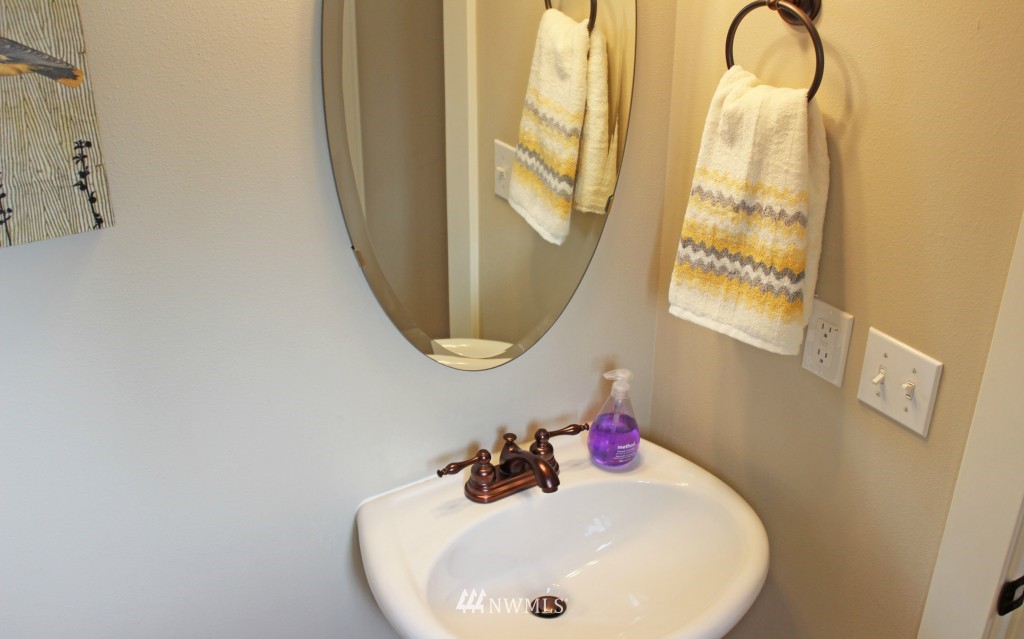 5020 Delridge Way Southwest, Unit A Seattle, WA 98106 - Photo 8 of 22 a bathroom with a sink and a mirror