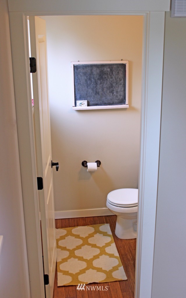 5020 Delridge Way Southwest, Unit A Seattle, WA 98106 - Photo 9 of 22 a bathroom with a toilet and a shower