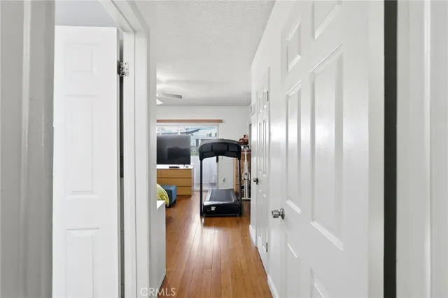 a view of gallery with wooden floor