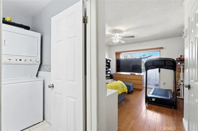 a view of living room with furniture and wooden floor