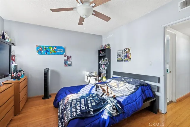 a bedroom with a bed and a table in it