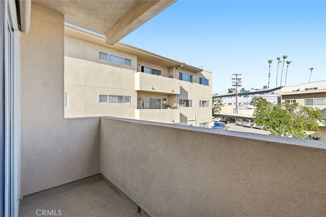 a view of a kitchen with a sink and cabinets