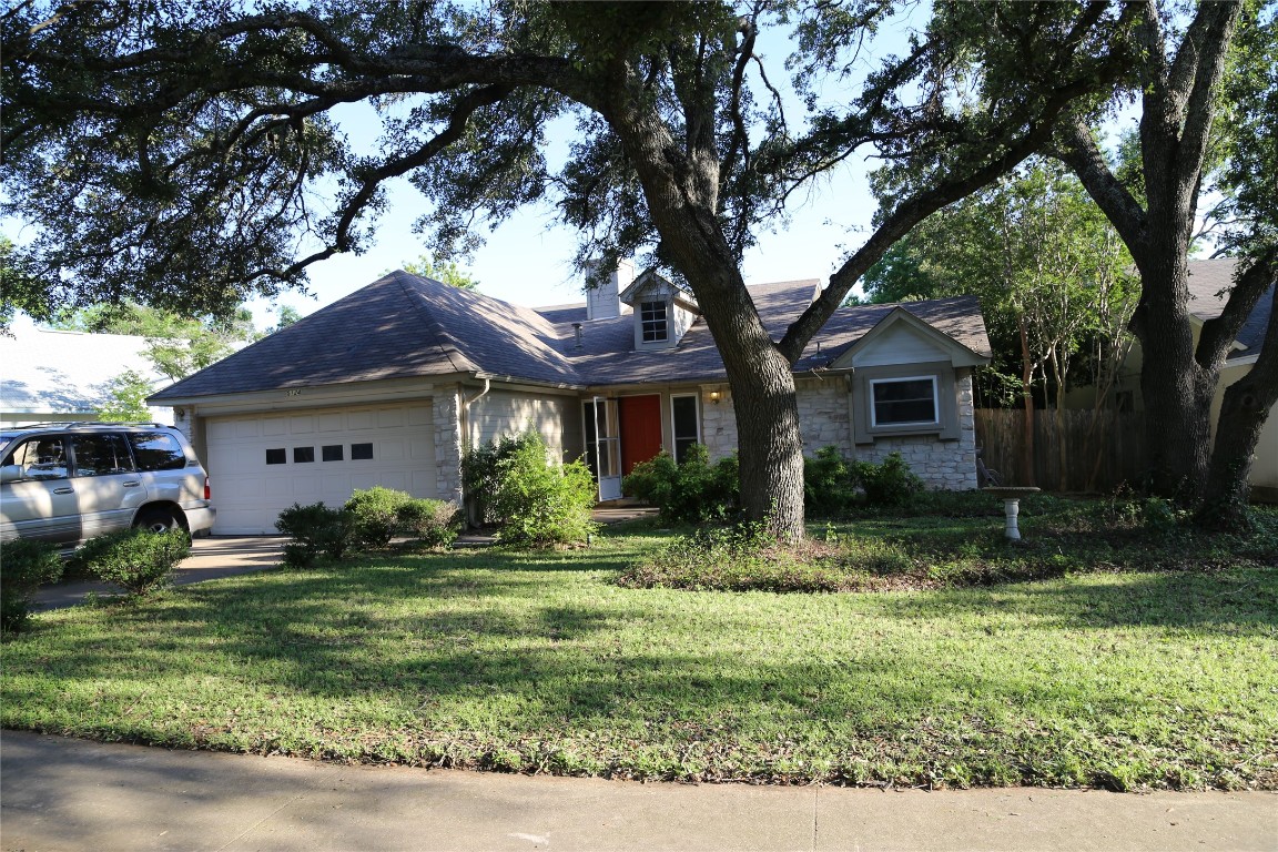 Undisclosed Address Austin, TX 78727 - Photo 1 of 36 a front view of a house with a yard