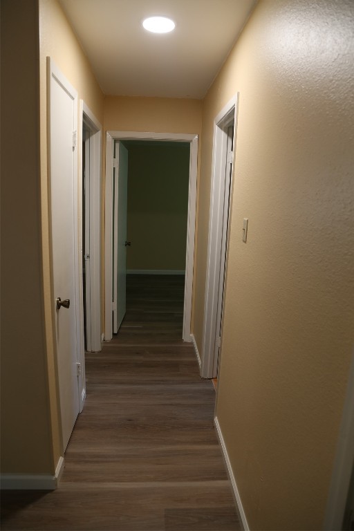 Undisclosed Address Austin, TX 78727 - Photo 13 of 36 a view of a hallway with wooden floor and staircase