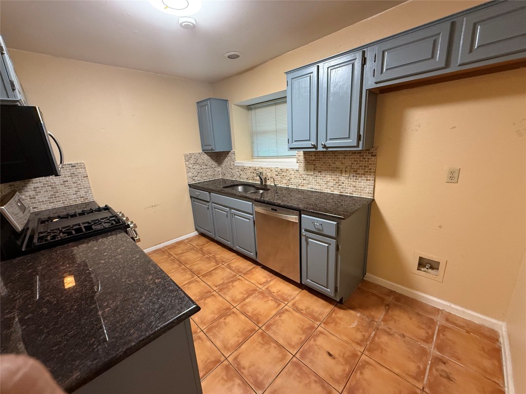 Undisclosed Address Austin, TX 78727 - Photo 26 of 36 a kitchen with stainless steel appliances granite countertop a stove a sink and a refrigerator