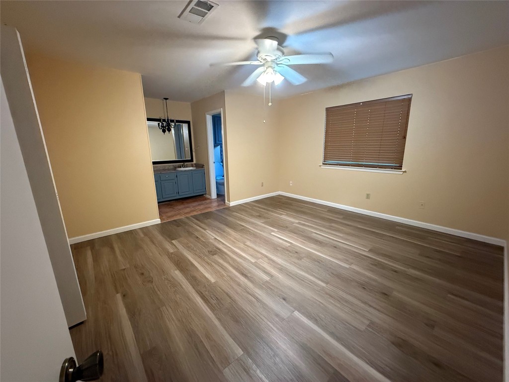 Undisclosed Address Austin, TX 78727 - Photo 32 of 36 a view of an empty room with window and wooden floor