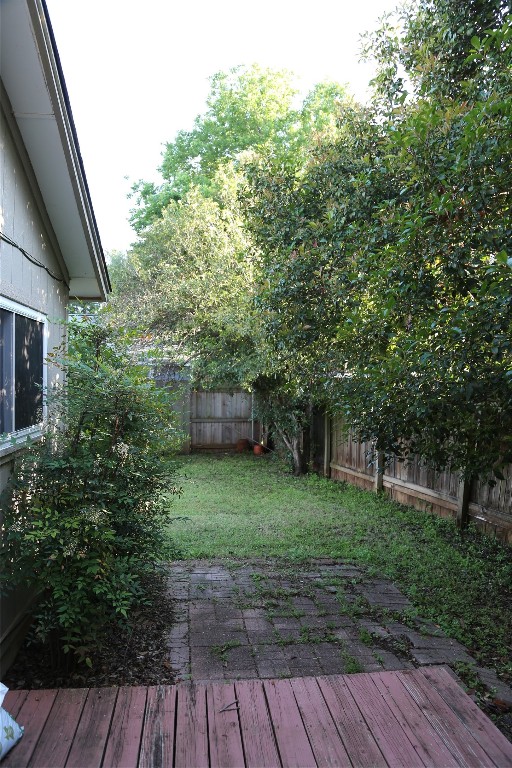 Undisclosed Address Austin, TX 78727 - Photo 4 of 36 a backyard of a house with lots of green space