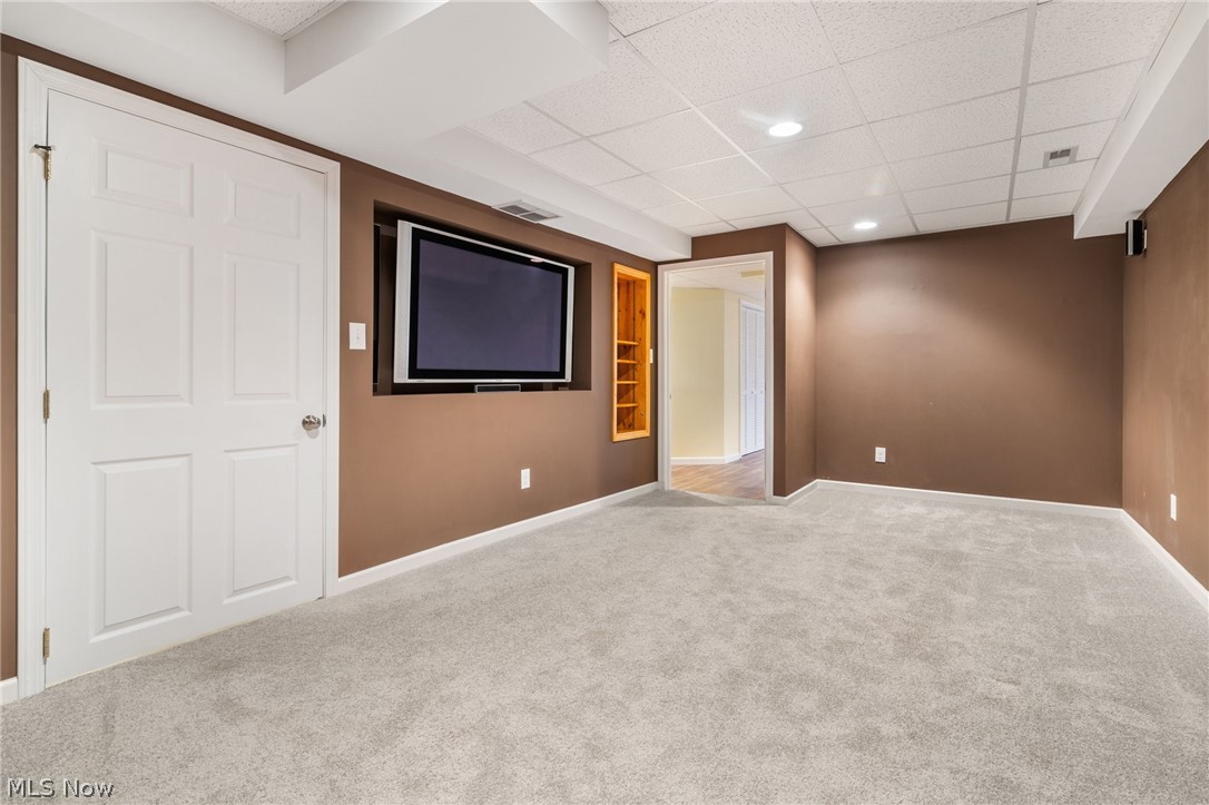 2414 Charing Cross Road Northwest Canton, OH 44708 - Photo 21 of 36 Carpeted media/theater room featuring a drop ceiling