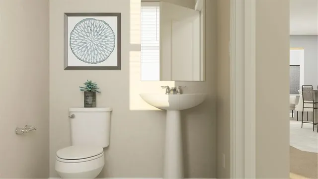 a bathroom with a toilet and a sink
