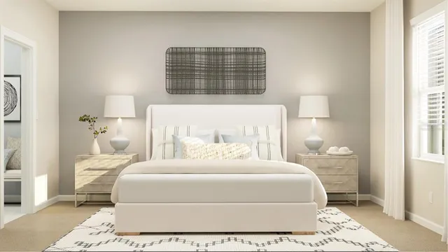 a bedroom with a large bed and a window