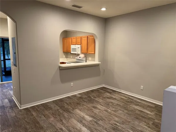 an empty room with mirror