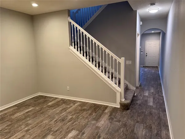 an entryway in a hall with a window