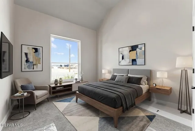 a bedroom with furniture and a window