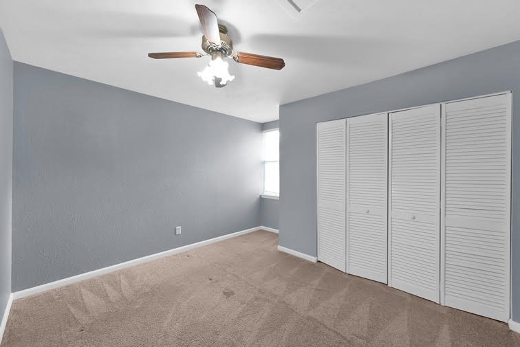 10902 Auger Place Spring, TX 77380 - Photo 12 of 21 a view of an empty room with chandelier fan