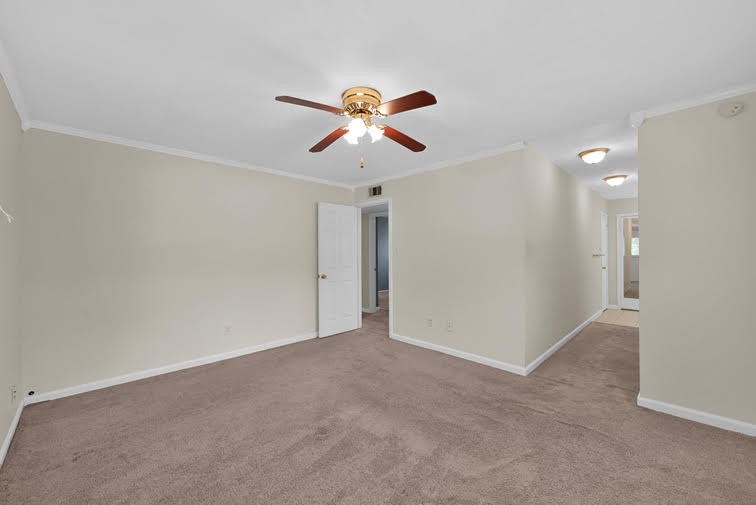 10902 Auger Place Spring, TX 77380 - Photo 17 of 21 a view of a room with a ceiling fan and window
