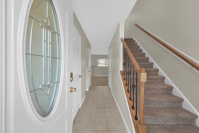 10902 Auger Place Spring, TX 77380 - Photo 3 of 21 a view of a hallway with wooden floor and entryway