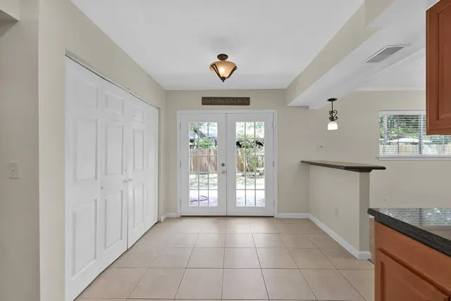 a view of an entryway with a kitchen