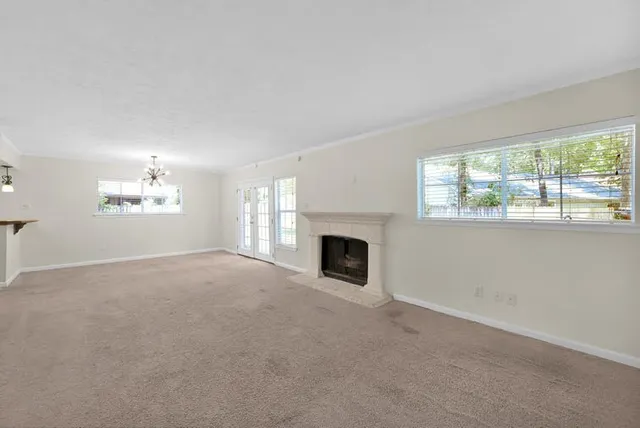 a view of empty room with windows