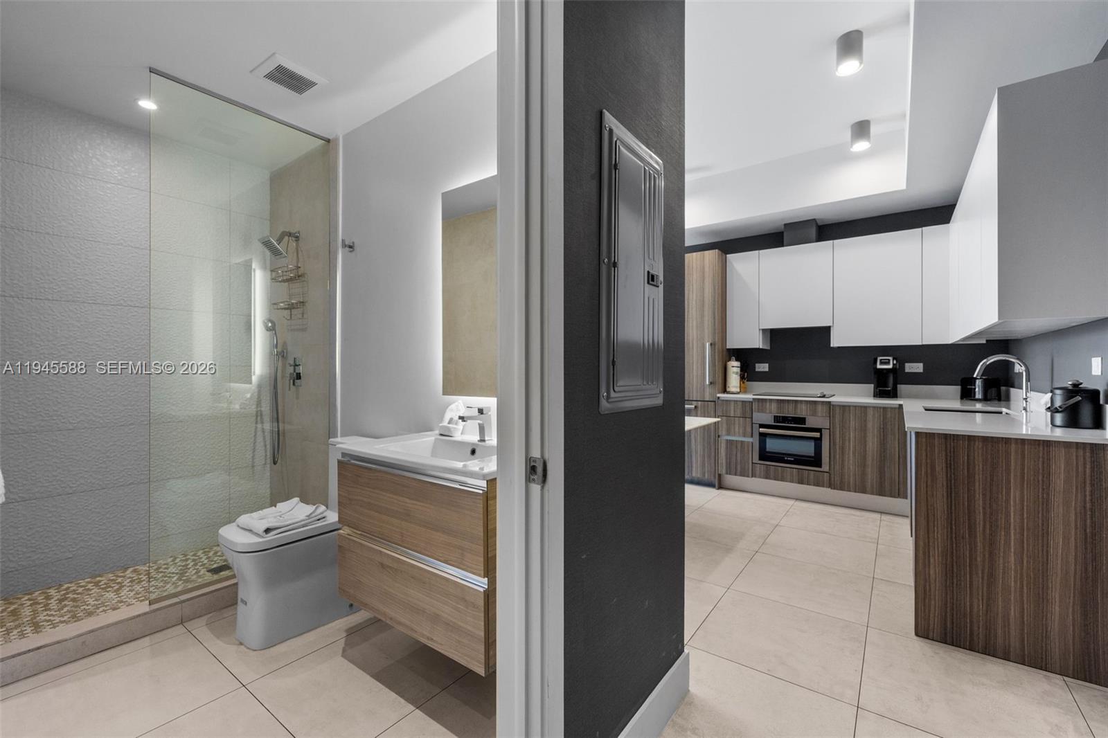 239 Southwest 9th Street, Unit 2102 Miami, FL 33130 - Photo 14 of 35 a kitchen with a sink and a refrigerator