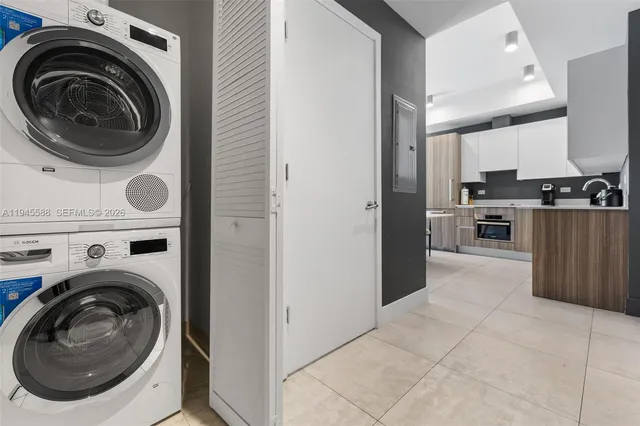 a view of a kitchen with washer and dryer