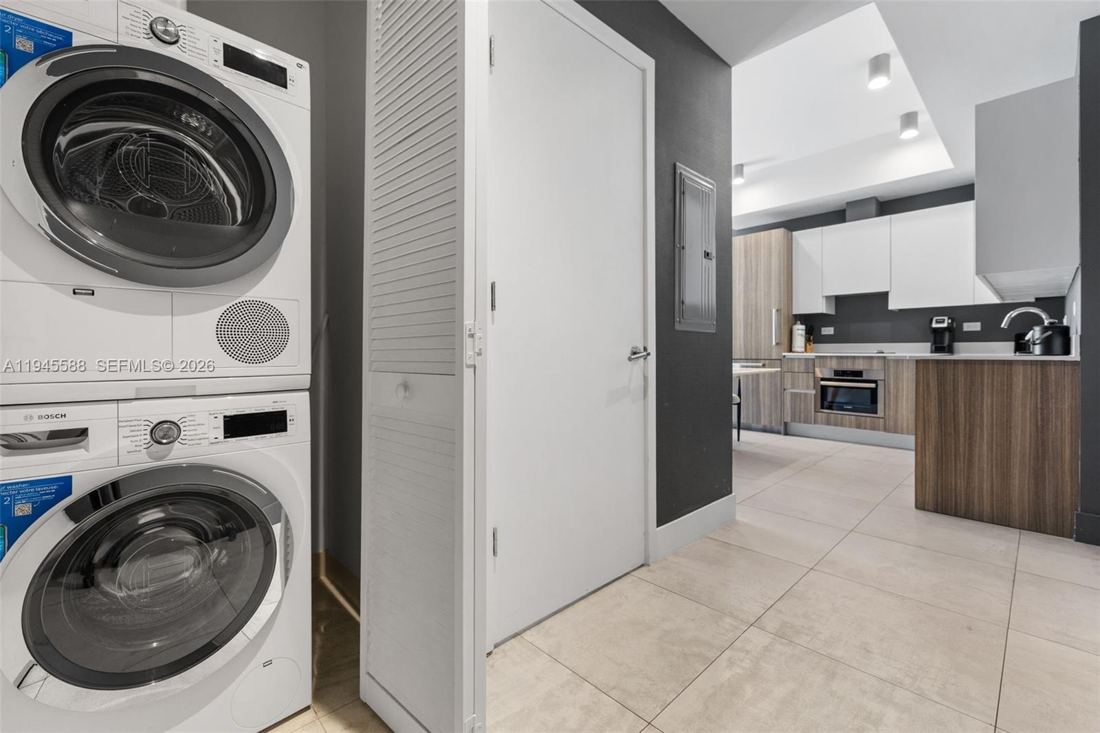 239 Southwest 9th Street, Unit 2102 Miami, FL 33130 - Photo 26 of 35 a view of a kitchen with washer and dryer