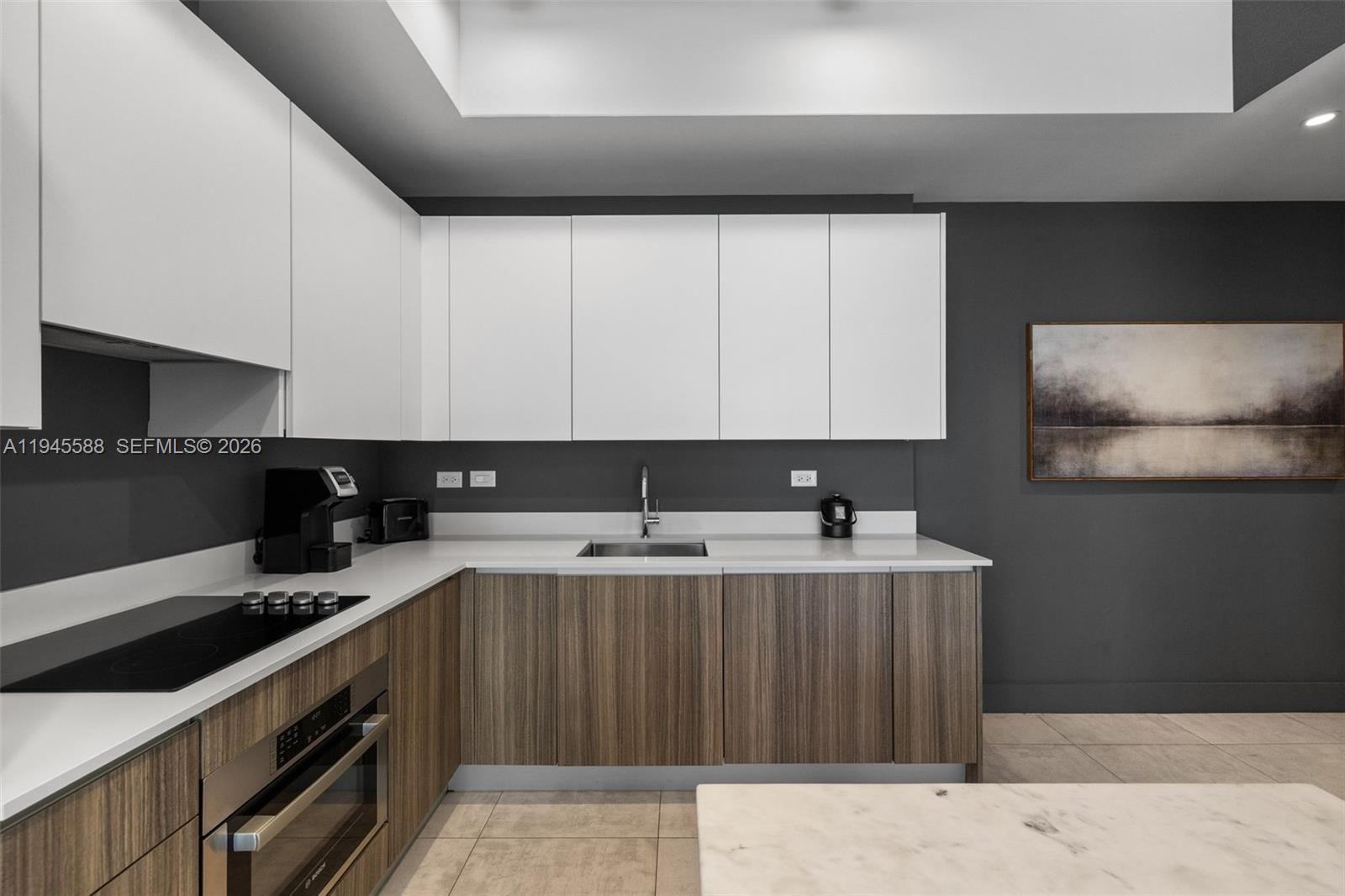 239 Southwest 9th Street, Unit 2102 Miami, FL 33130 - Photo 6 of 35 a kitchen with a sink and cabinets